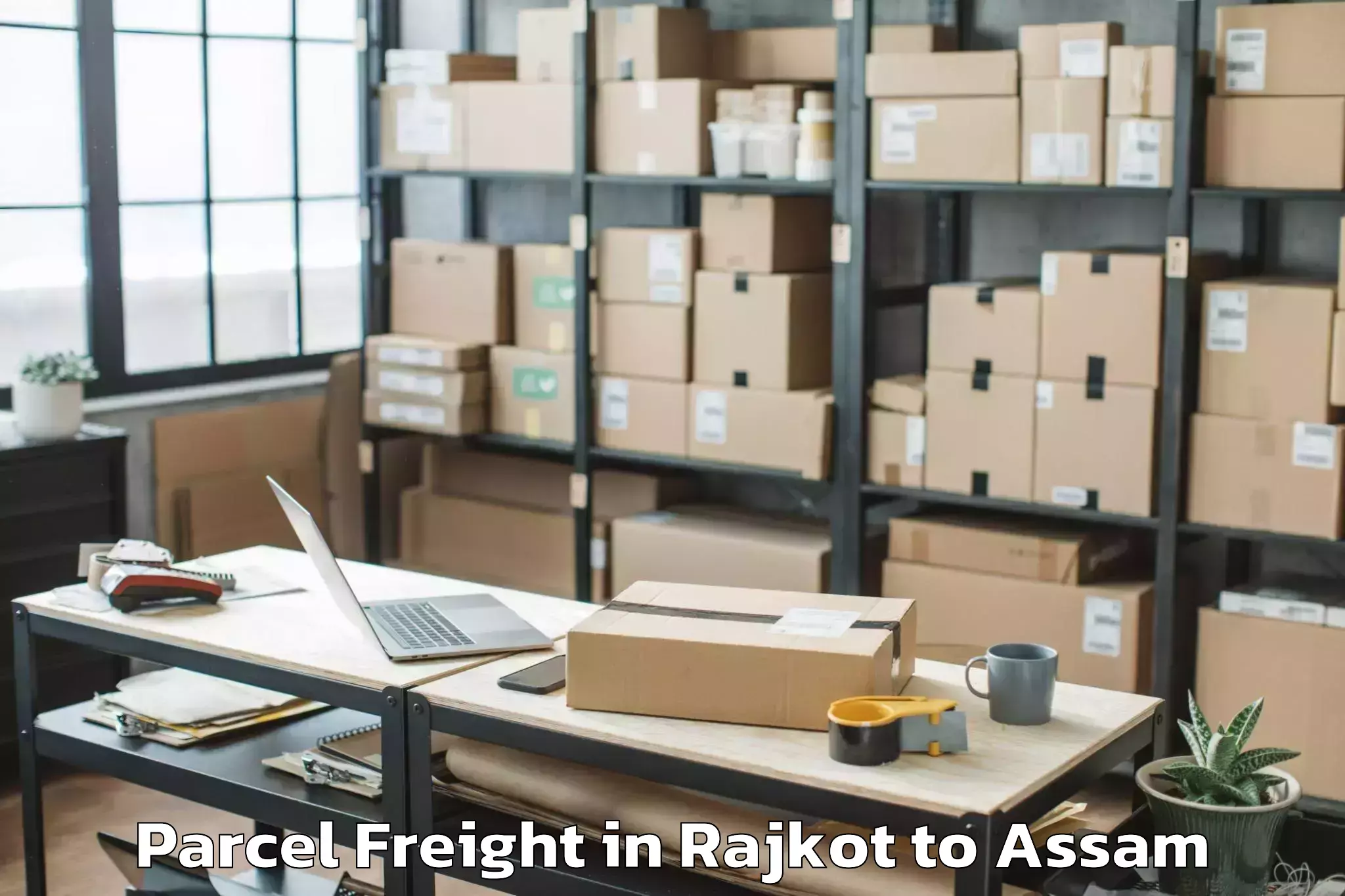 Easy Rajkot to Gohpur Parcel Freight Booking